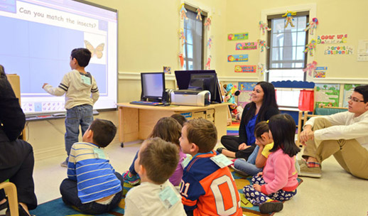 Child working on smart board