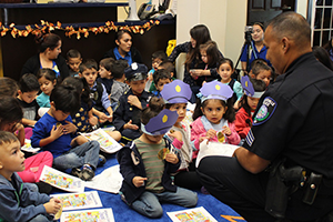 The Brownsville Police Department’s Sgt. David De León speaks to children about safety during Community Helper’s Week at the TSC Early Childhood Center on Oct. 27, 2015