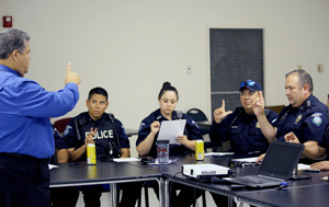 Texas Southmost College Sign Language Interpreter Frank Slovak gives sign language instruction to a group of Brownsville Police Officers and TSC Security Officers in June.